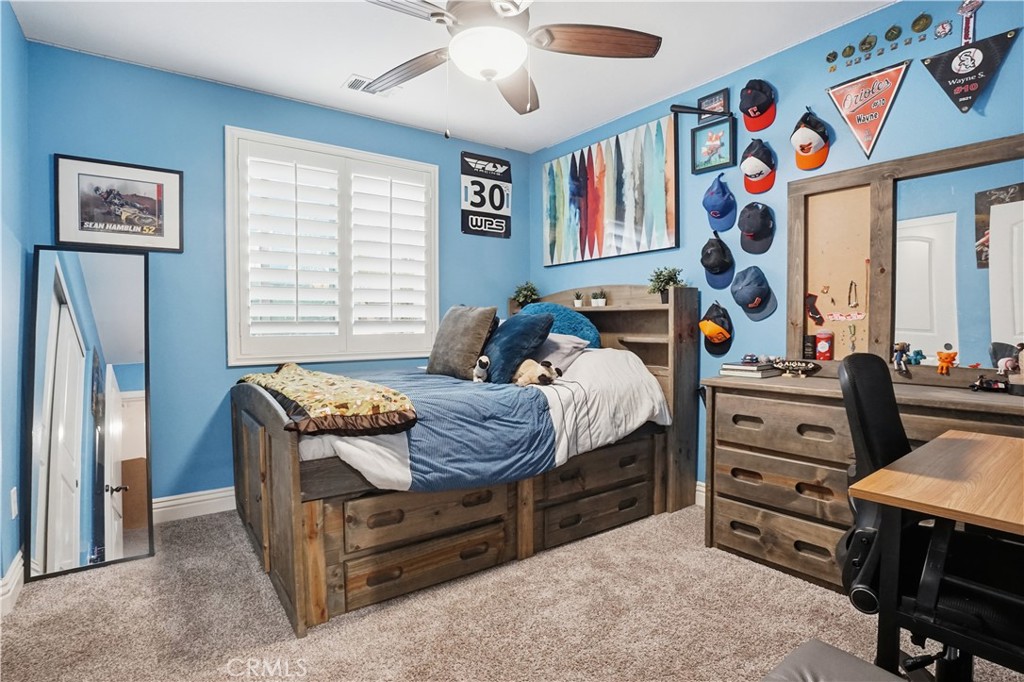 25654 Red Hawk Road Corona, CA 92883 - Photo 35 of 75 a bedroom with a bed and a dresser in it