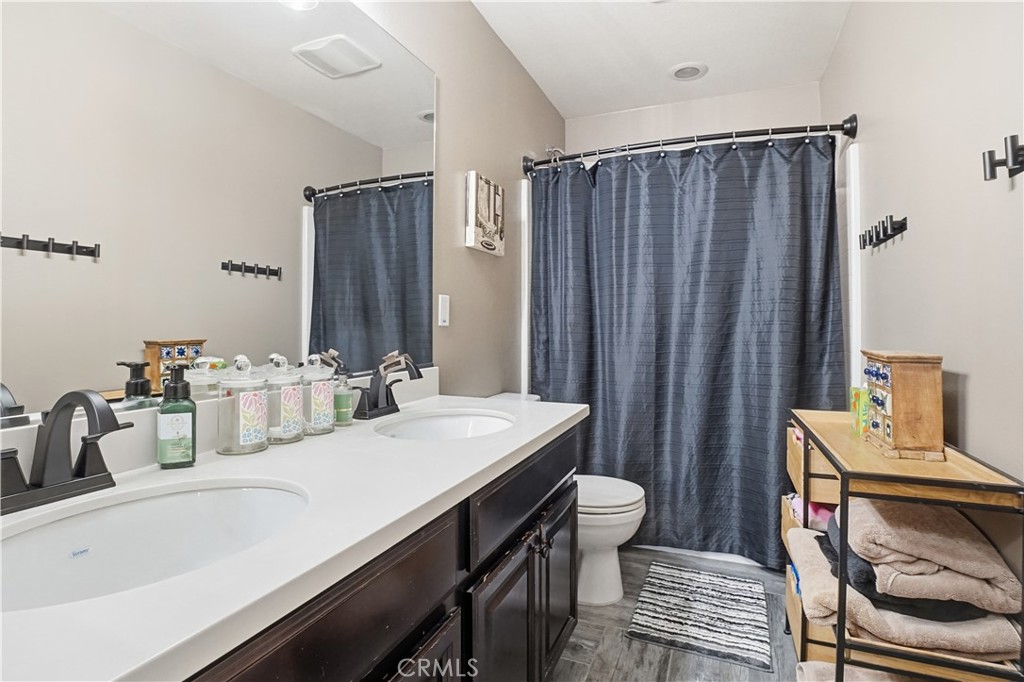 25654 Red Hawk Road Corona, CA 92883 - Photo 39 of 75 a bathroom with a sink and a mirror