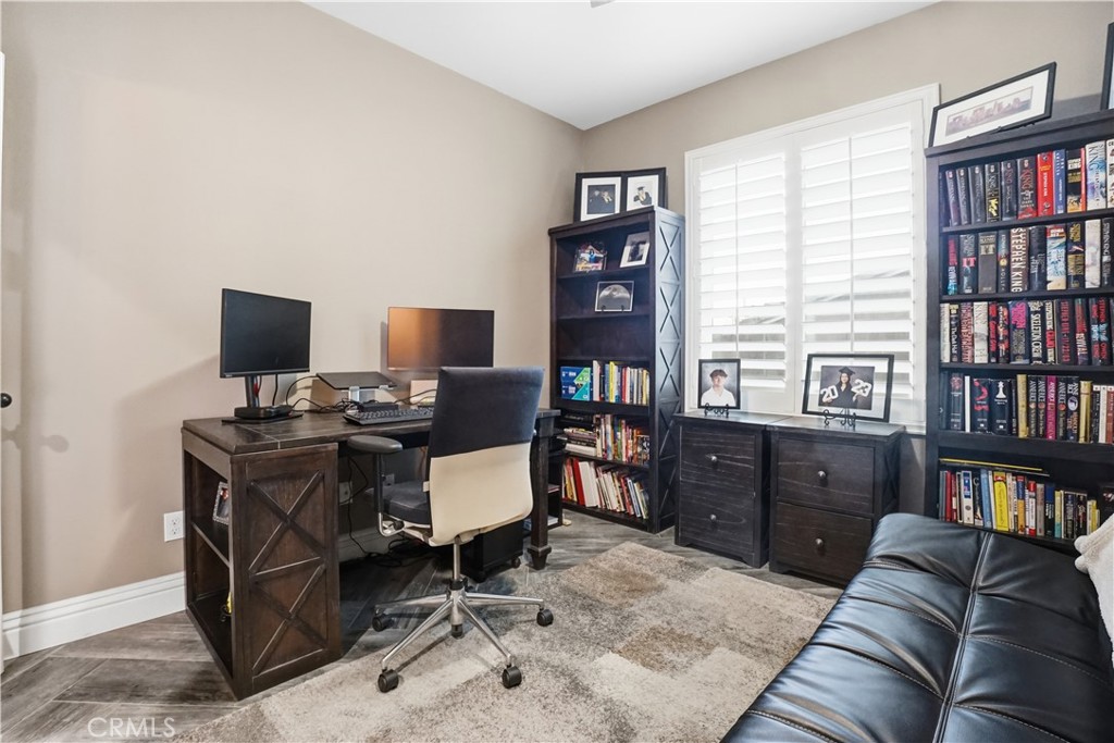 25654 Red Hawk Road Corona, CA 92883 - Photo 5 of 75 a view of a livingroom with workspace and a window