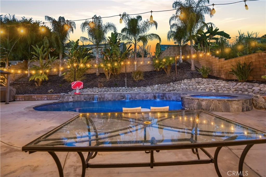 25654 Red Hawk Road Corona, CA 92883 - Photo 52 of 75 a view of a swimming pool with lounge chairs