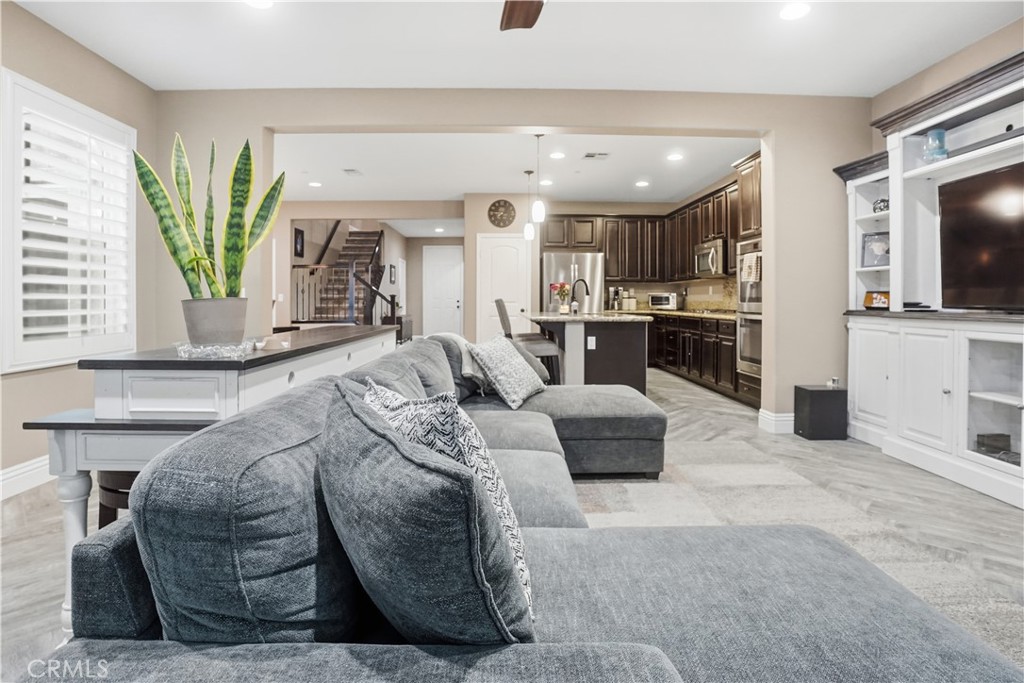 25654 Red Hawk Road Corona, CA 92883 - Photo 8 of 75 a living room with furniture and a flat screen tv