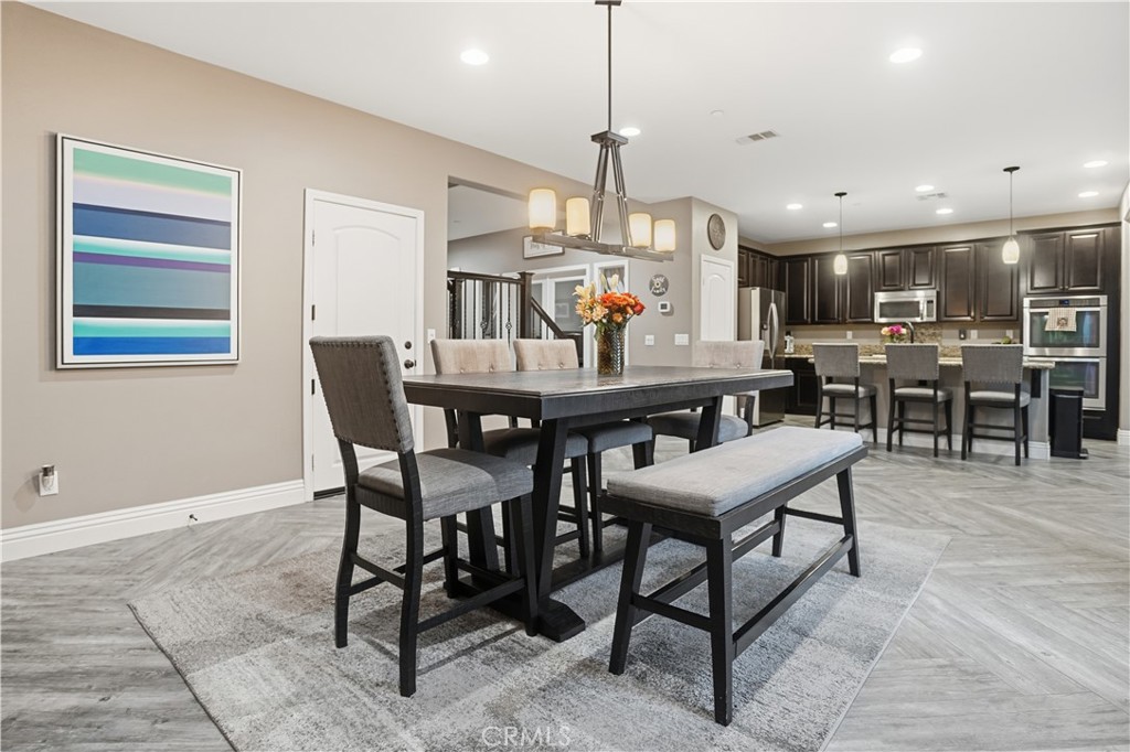 25654 Red Hawk Road Corona, CA 92883 - Photo 9 of 75 a view of a dining room with furniture