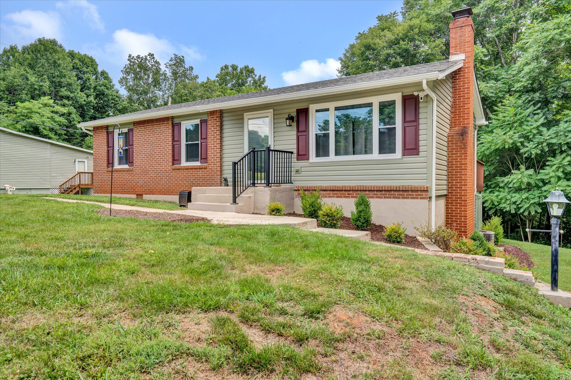 3382 Thomasson Mill Road Goodview, VA 24095 - Photo 2 of 20 a front view of house with yard and green space