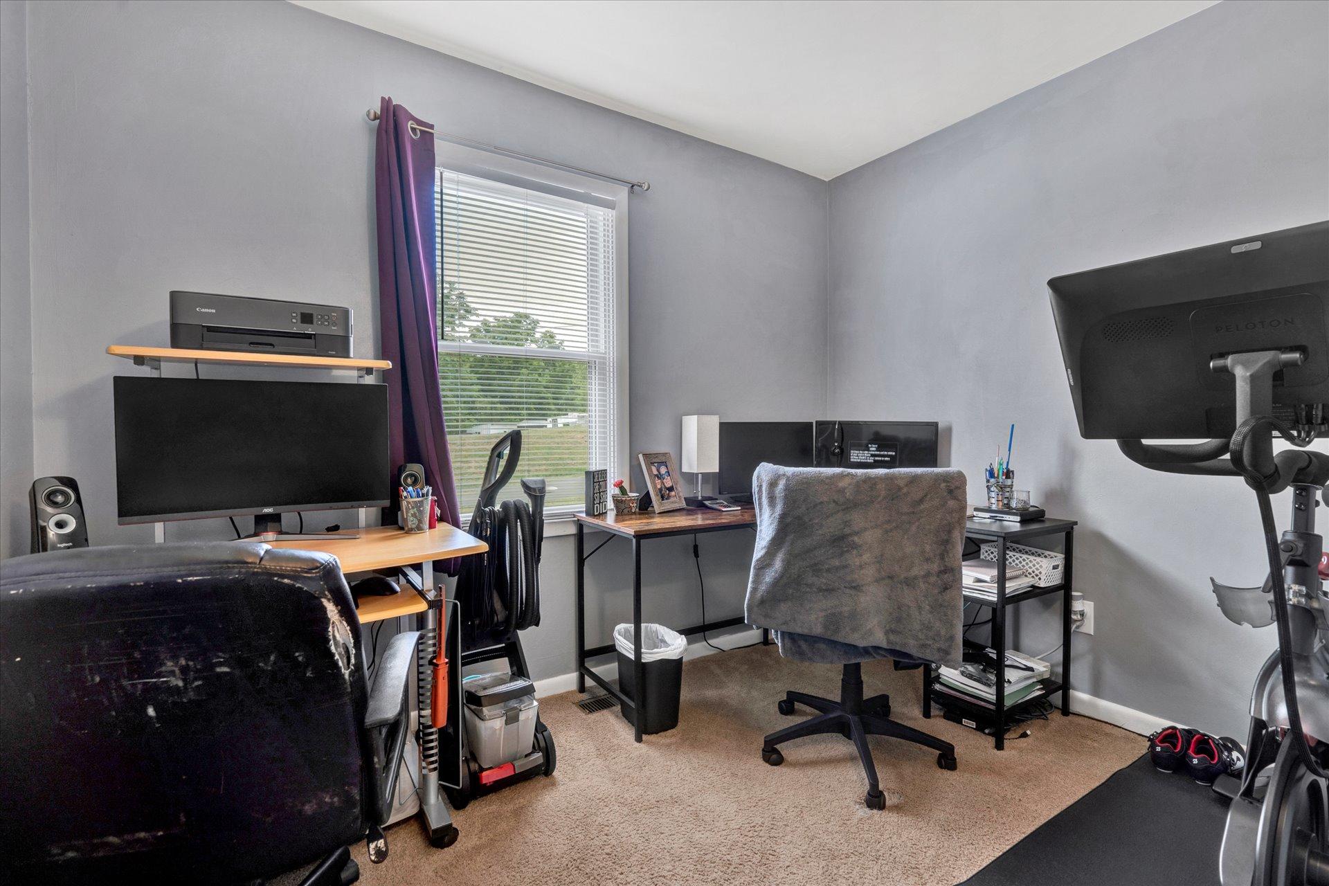 3382 Thomasson Mill Road Goodview, VA 24095 - Photo 11 of 20 a view of a workspace with furniture and a window