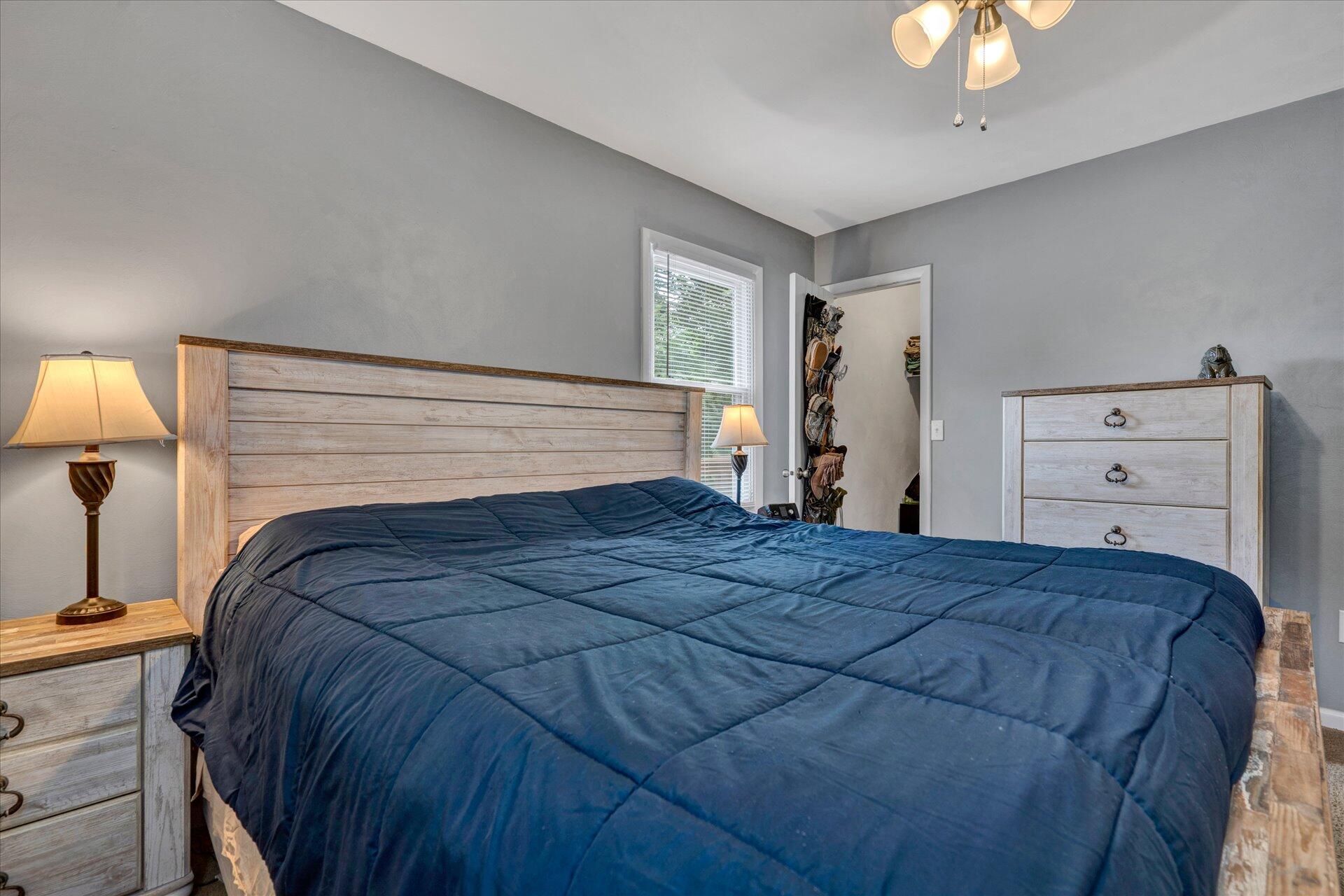3382 Thomasson Mill Road Goodview, VA 24095 - Photo 14 of 20 a bedroom with a bed and a window