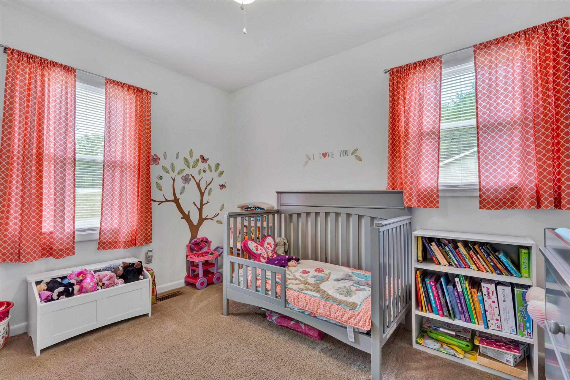 3382 Thomasson Mill Road Goodview, VA 24095 - Photo 16 of 20 a bedroom with furniture and a book shelf
