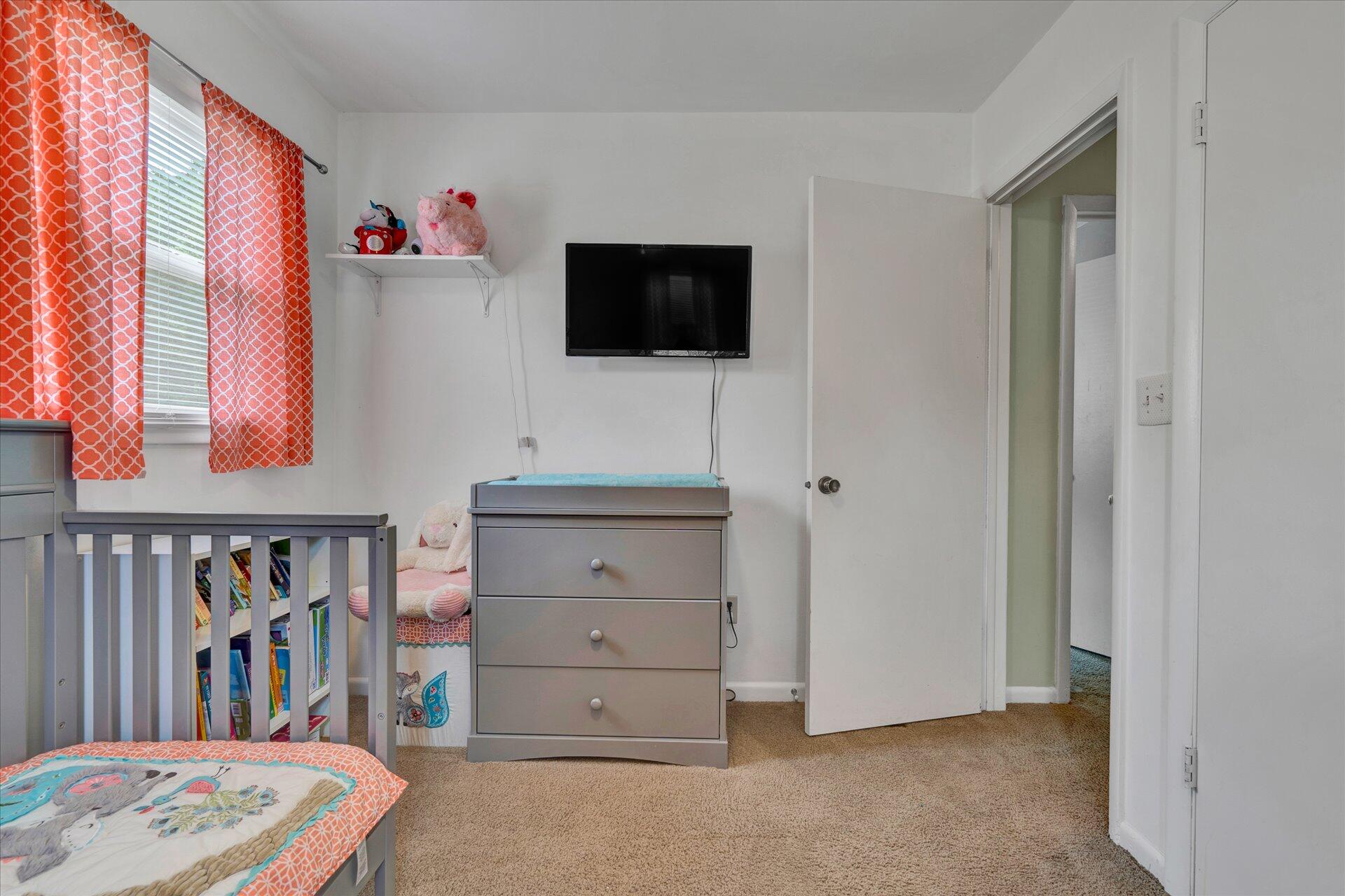 3382 Thomasson Mill Road Goodview, VA 24095 - Photo 17 of 20 a living room with furniture and a flat screen tv
