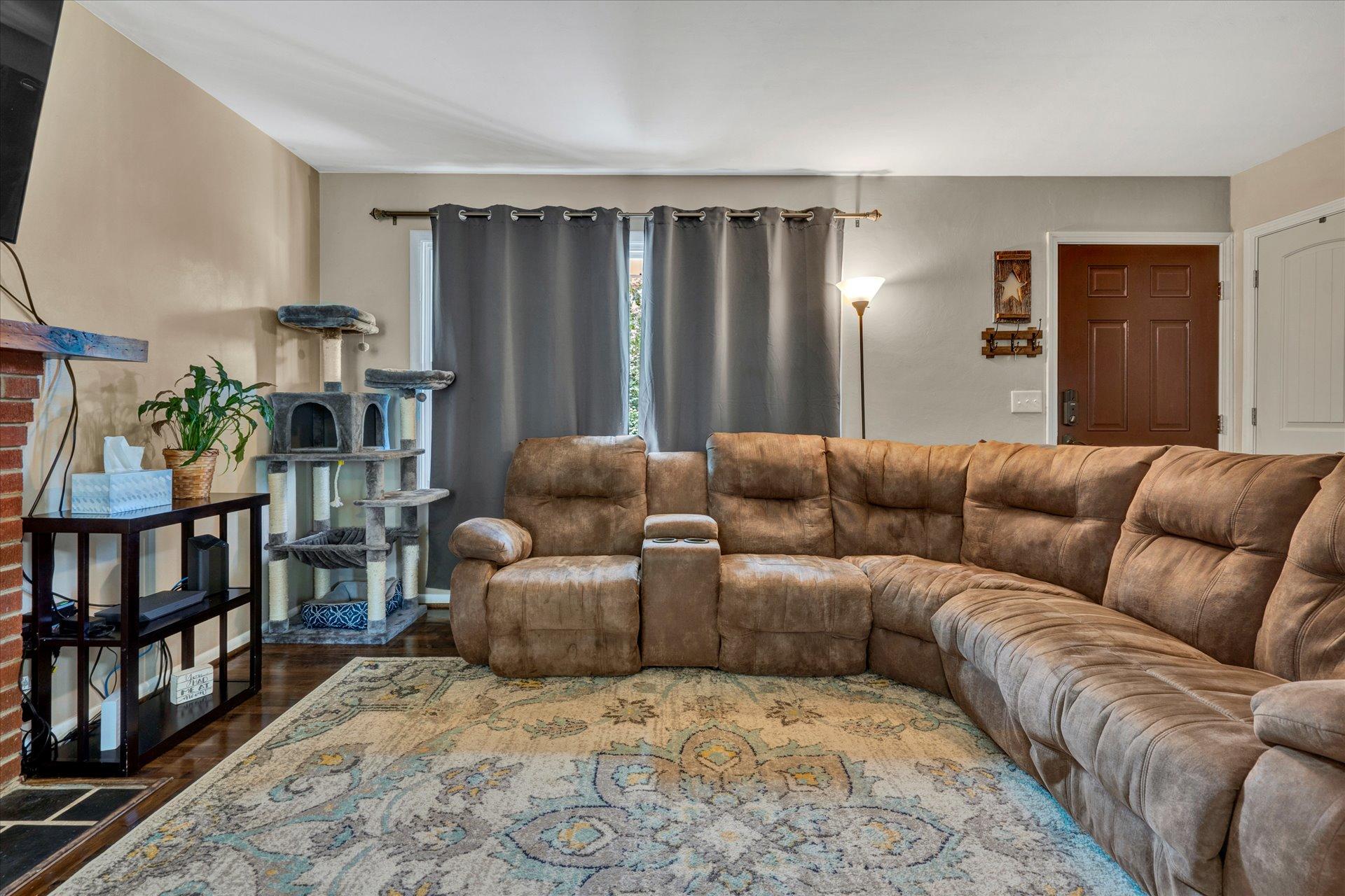 3382 Thomasson Mill Road Goodview, VA 24095 - Photo 6 of 20 a living room with furniture and a book shelf