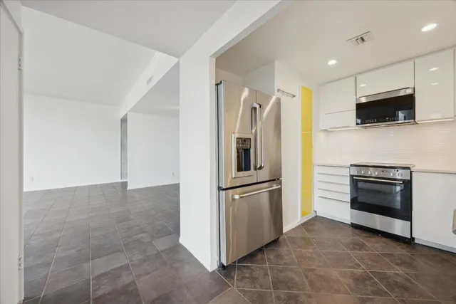 a view of balcony with furniture