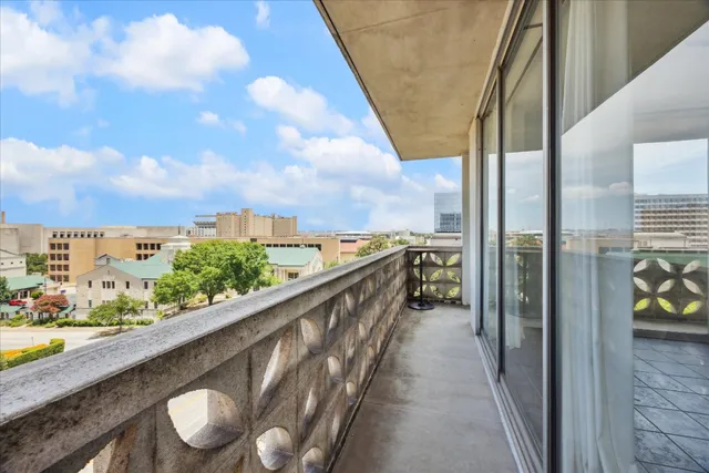 a view of a balcony with wooden floor