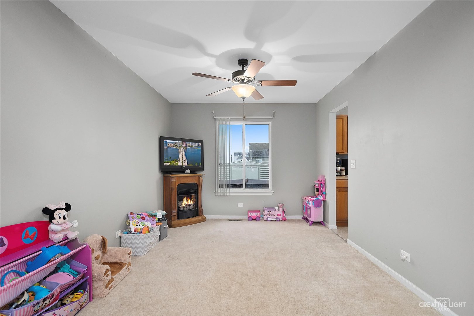 605 Ramsden Road Plano, IL 60545 - Photo 16 of 22 a bedroom with furniture and a chandelier fan