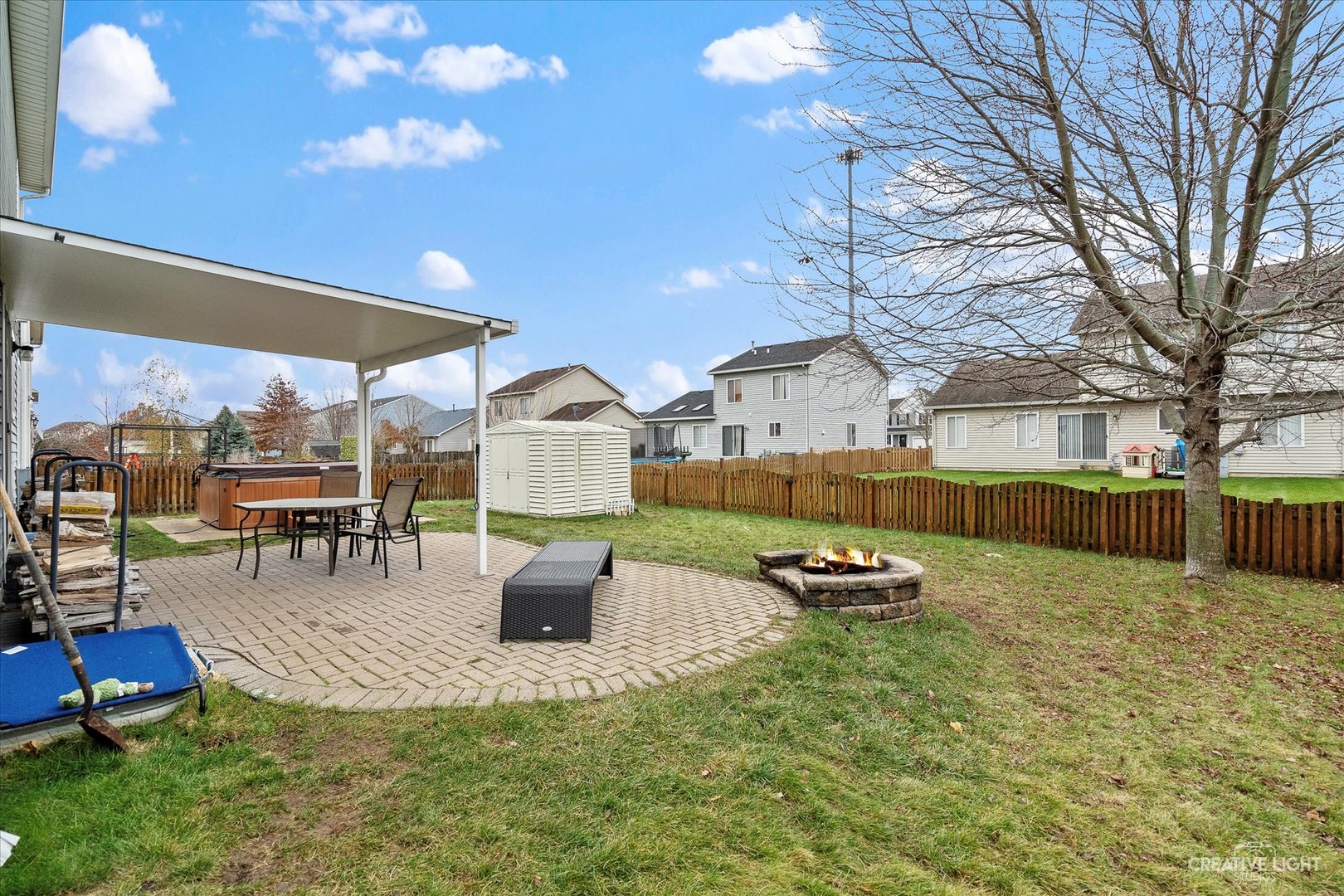 605 Ramsden Road Plano, IL 60545 - Photo 20 of 22 a backyard of a house with barbeque oven table and chairs