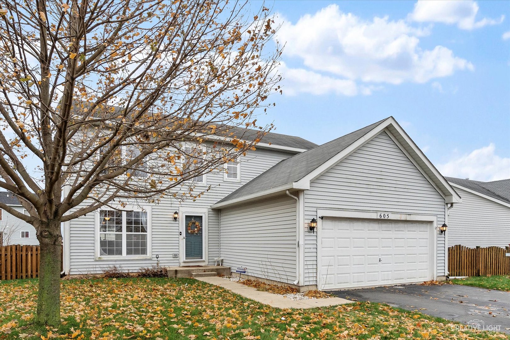 605 Ramsden Road Plano, IL 60545 - Photo 2 of 22 a view of a house with a backyard