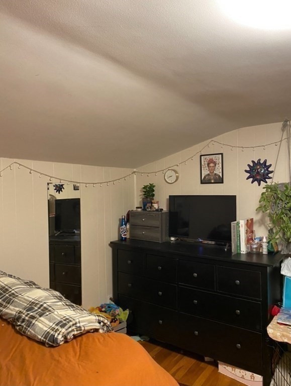 7 Granite Street, Unit 2 Cambridge, MA 02139 - Photo 15 of 31 a bedroom with a bed and a flat screen tv