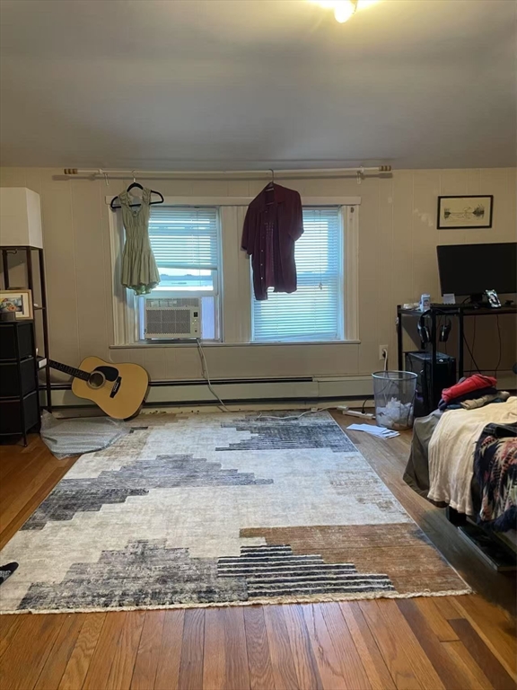 7 Granite Street, Unit 2 Cambridge, MA 02139 - Photo 21 of 31 a bedroom with a bed and wooden floor
