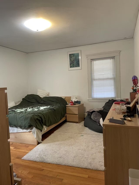 7 Granite Street, Unit 2 Cambridge, MA 02139 - Photo 24 of 31 a bedroom with a bed a couch and a window