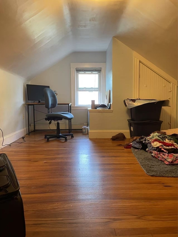 7 Granite Street, Unit 2 Cambridge, MA 02139 - Photo 25 of 31 a living room with furniture and a wooden floor