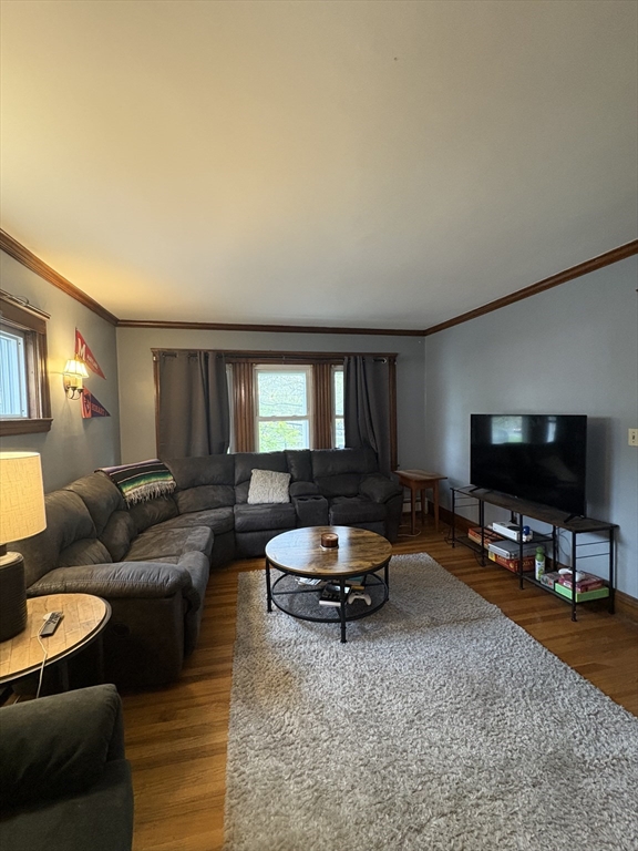 7 Granite Street, Unit 2 Cambridge, MA 02139 - Photo 27 of 31 a living room with furniture and a flat screen tv