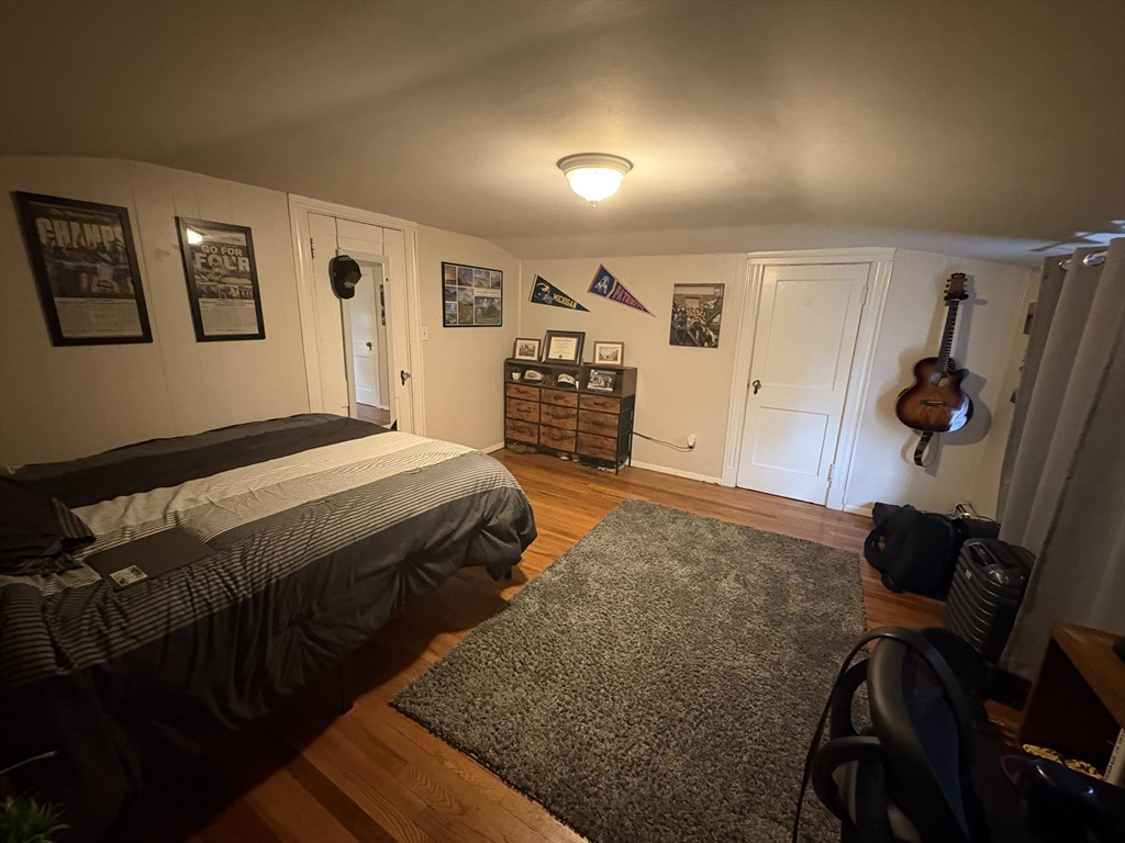 7 Granite Street, Unit 2 Cambridge, MA 02139 - Photo 31 of 31 a bedroom with a bed and a walk in closet