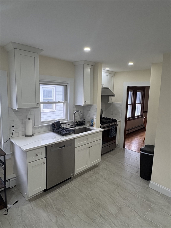 7 Granite Street, Unit 2 Cambridge, MA 02139 - Photo 4 of 31 a kitchen with granite countertop a sink stainless steel appliances and cabinets