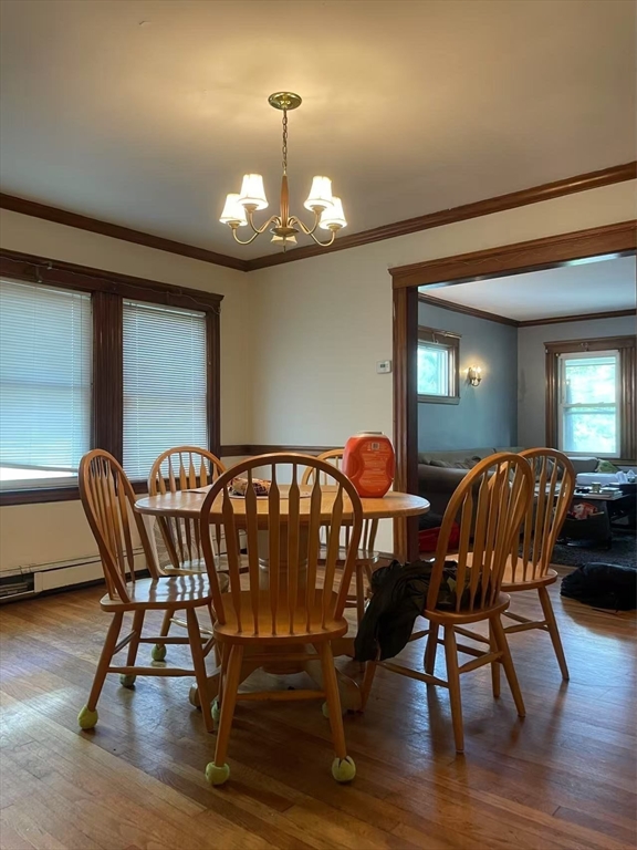 7 Granite Street, Unit 2 Cambridge, MA 02139 - Photo 5 of 31 a view of a dining room with furniture wooden floor and chandelier