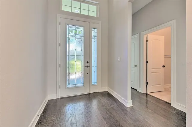 a kitchen with granite countertop a sink stove and wooden cabinets