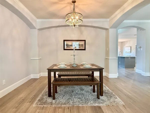 a view of a livingroom with furniture and wooden floor
