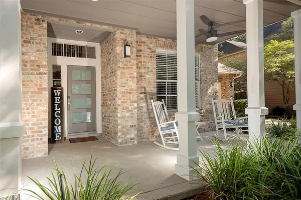 a front view of a house with outdoor seating