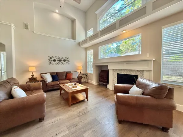 a living room with furniture and a fireplace