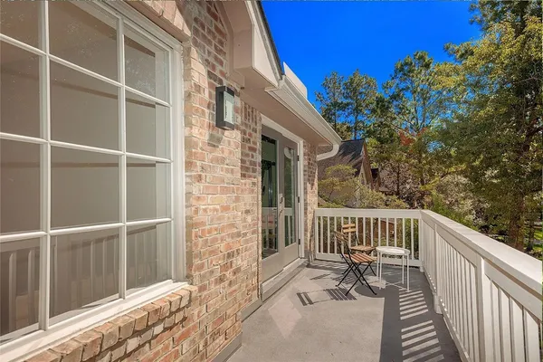 a view of a balcony with chairs