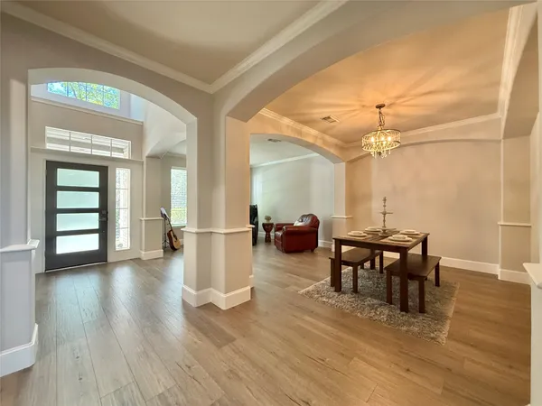 a view of a livingroom with furniture and wooden floor