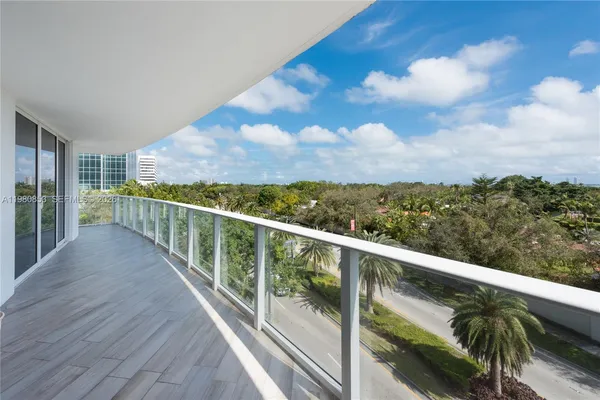 a view of balcony with furniture