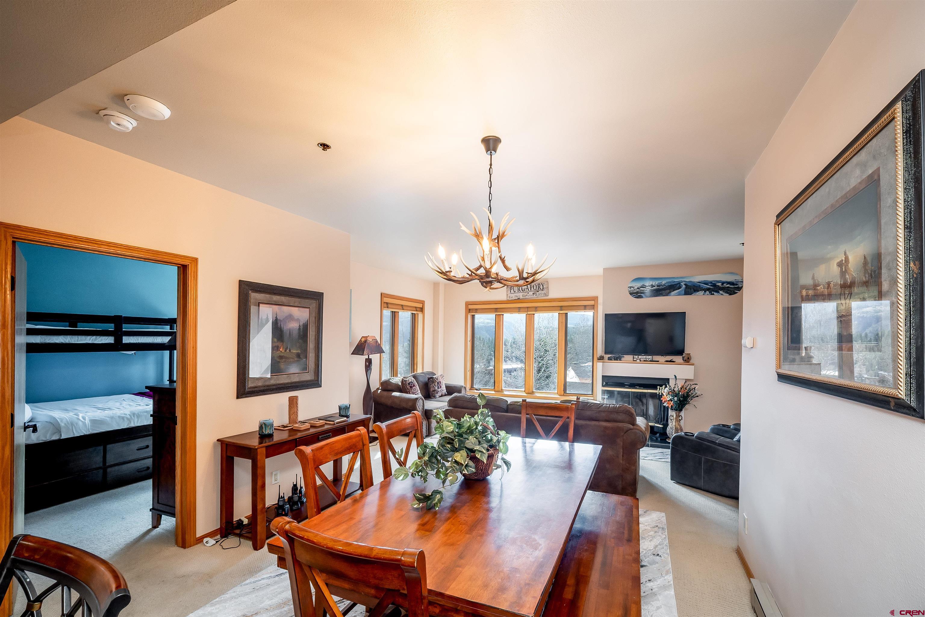 71 East Needles Road, Unit 337 Durango, CO 81301 - Photo 16 of 45 a view of a dining room with furniture window and wooden floor