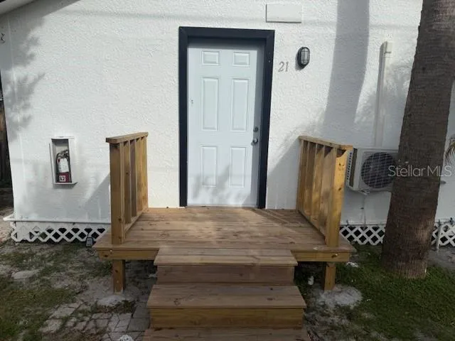 a living room with chairs and a table
