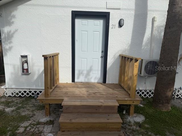 a living room with chairs and a table
