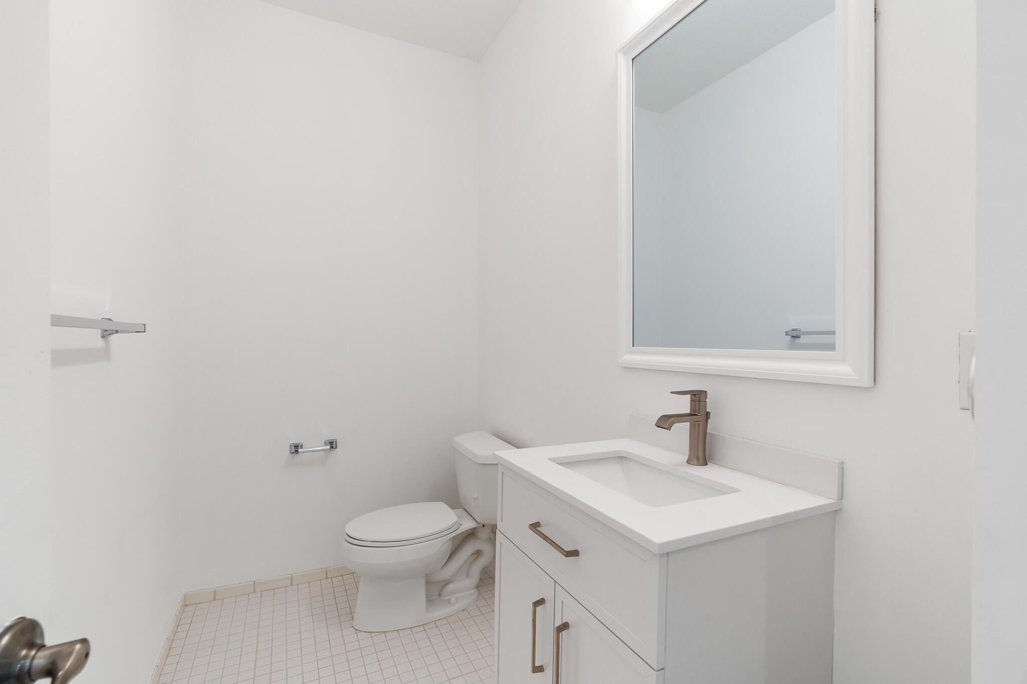 3830 Northwest 5th Terrace Boca Raton, FL 33431 - Photo 12 of 34 a bathroom with a sink a toilet and a mirror