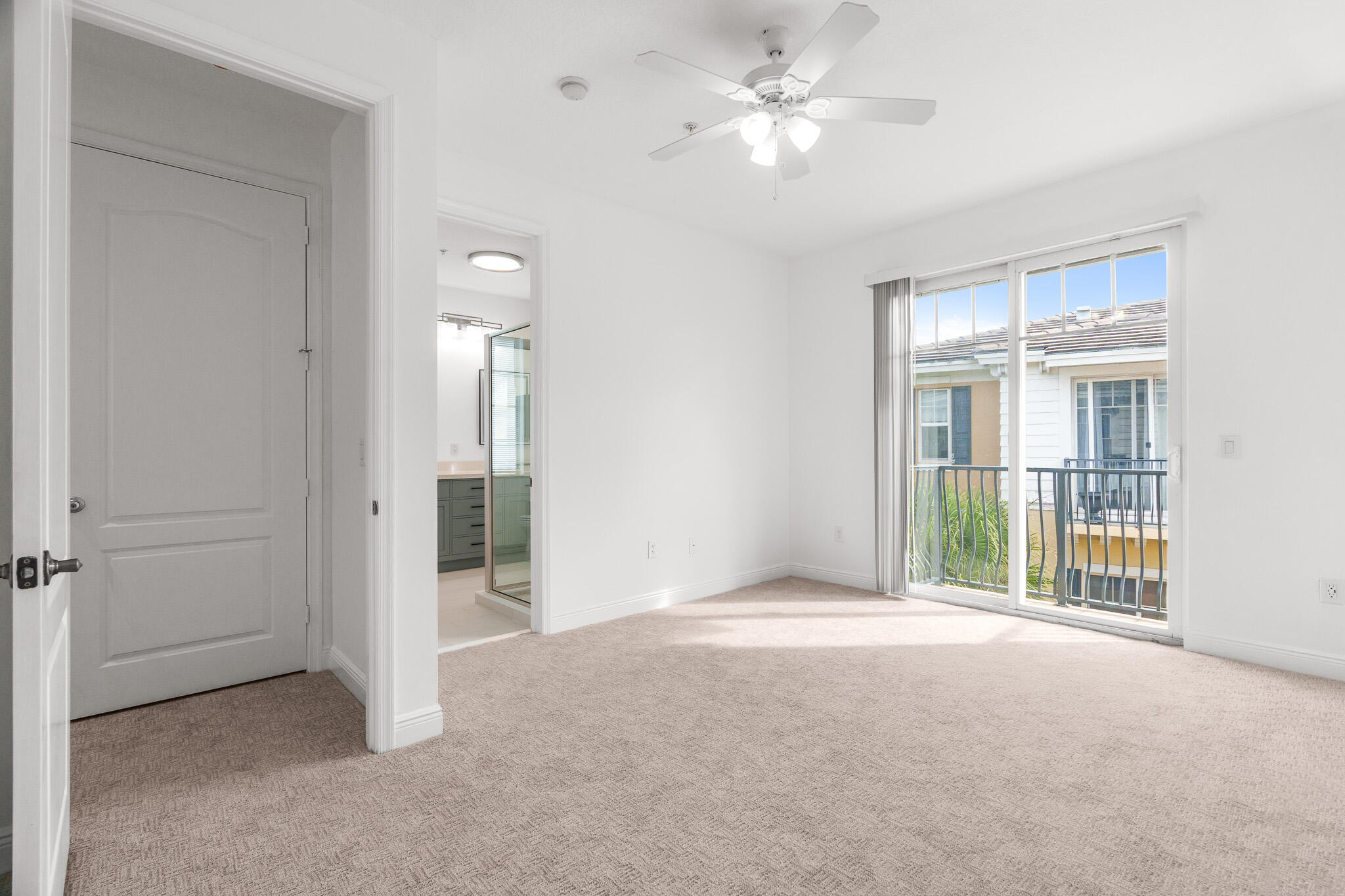 3830 Northwest 5th Terrace Boca Raton, FL 33431 - Photo 24 of 34 an empty room with chandelier fan and windows
