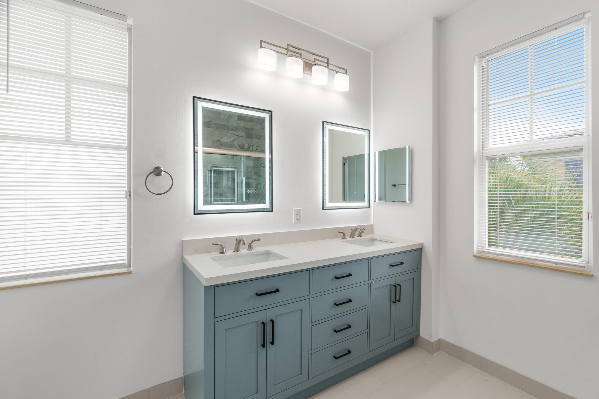 3830 Northwest 5th Terrace Boca Raton, FL 33431 - Photo 26 of 34 a bathroom with a double vanity sink a mirror and a window