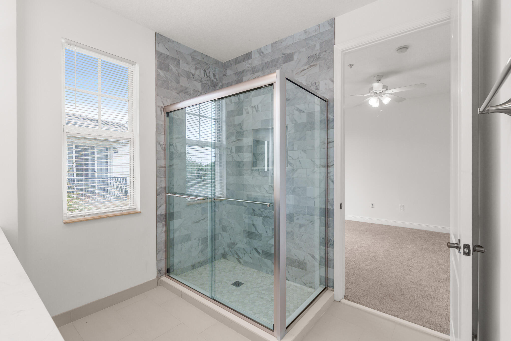 3830 Northwest 5th Terrace Boca Raton, FL 33431 - Photo 27 of 34 a bathroom that has a glass shower door