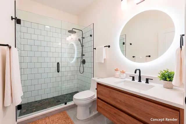 a bathroom with a sink a toilet and shower