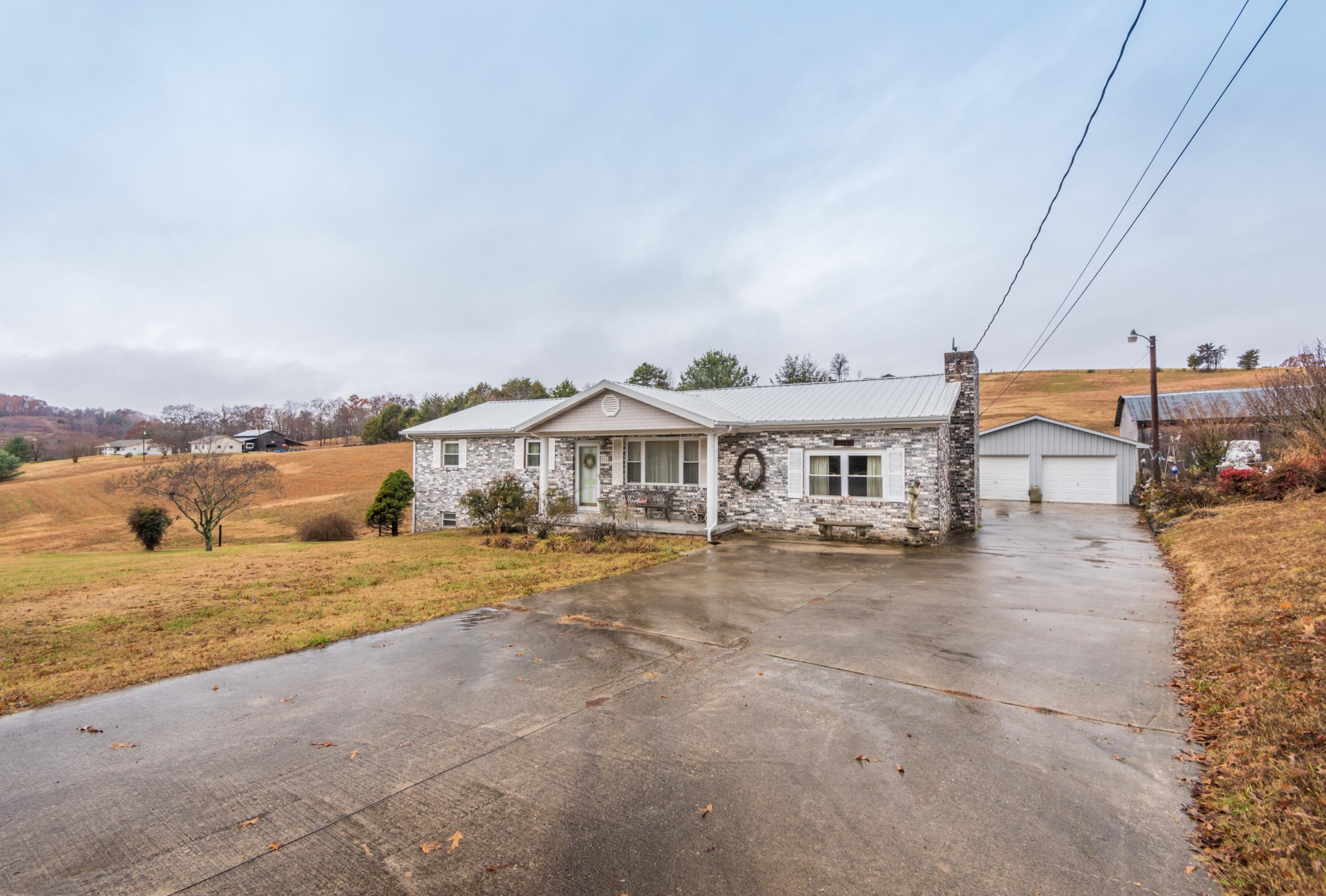 275 North Ridge View Road Luttrell, TN 37779 - Photo 21 of 27 a view of a big room with a big yard and large trees
