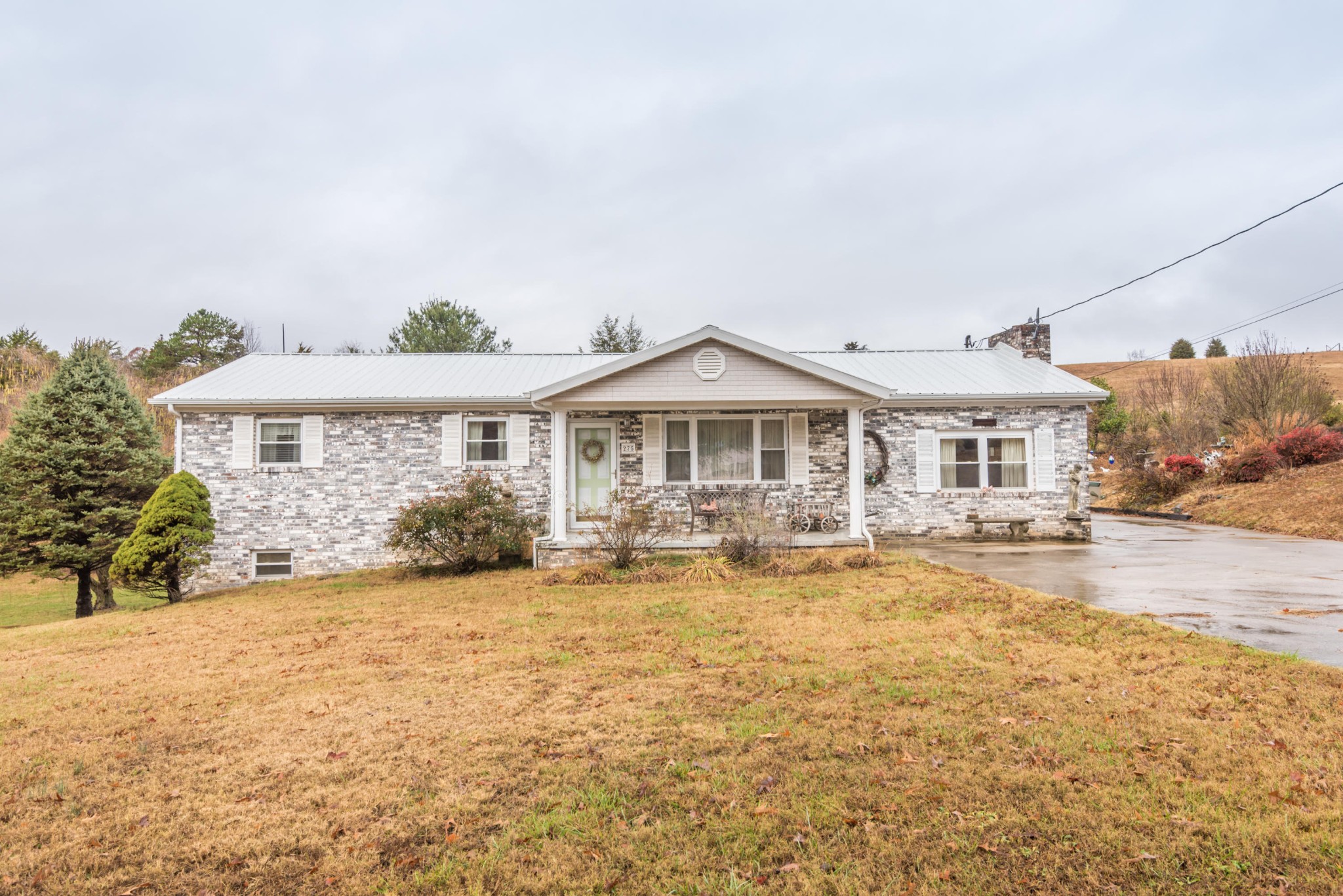 275 North Ridge View Road Luttrell, TN 37779 - Photo 26 of 27 a front view of house with yard outdoor seating and barbeque oven