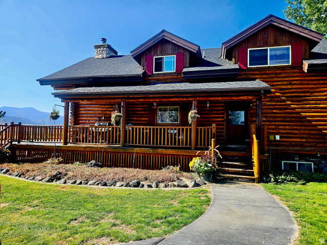 76 Highway 118 Monroe, UT 84754 - Photo 5 of 76 Cabin featuring log exterior, a shingled roof, a porch, and a chimney