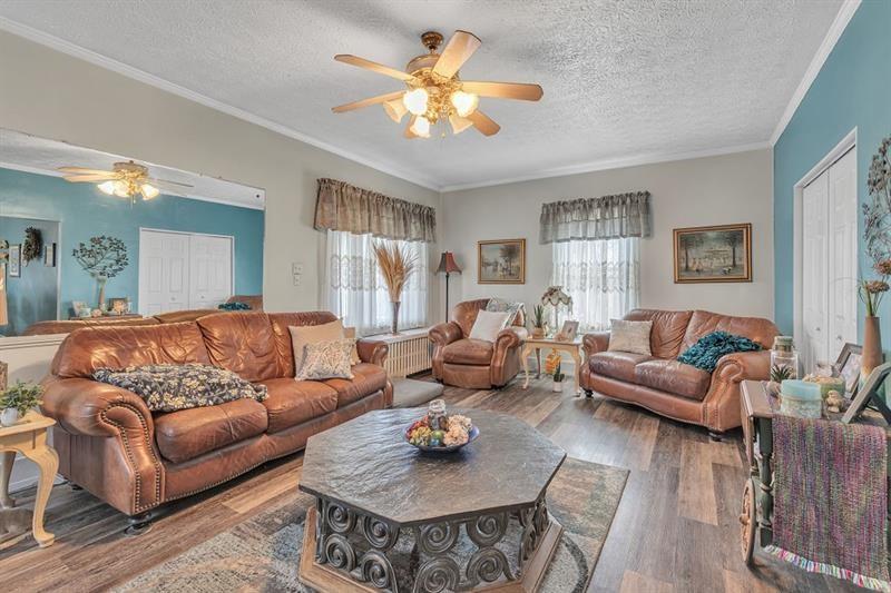 3159 Brodhead Road Aliquippa, PA 15001 - Photo 4 of 30 a living room with furniture and a chandelier