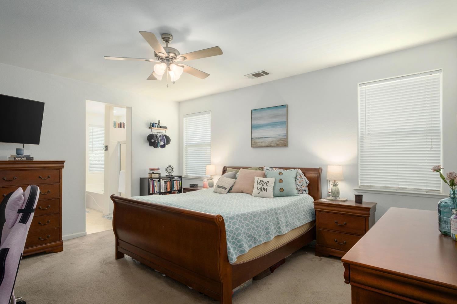 454 Sierra Avenue Reedley, CA 93654 - Photo 16 of 25 a bedroom with a bed and a flat screen tv