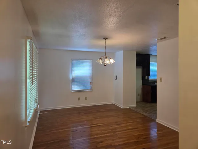 a view of a kitchen cabinets and wooden floor
