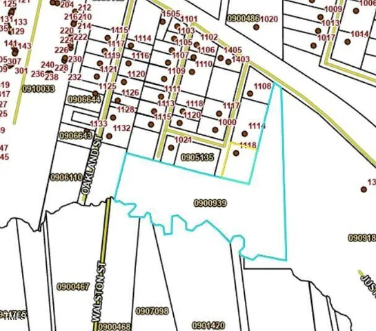 a view of a hallway with wooden floor and closet area