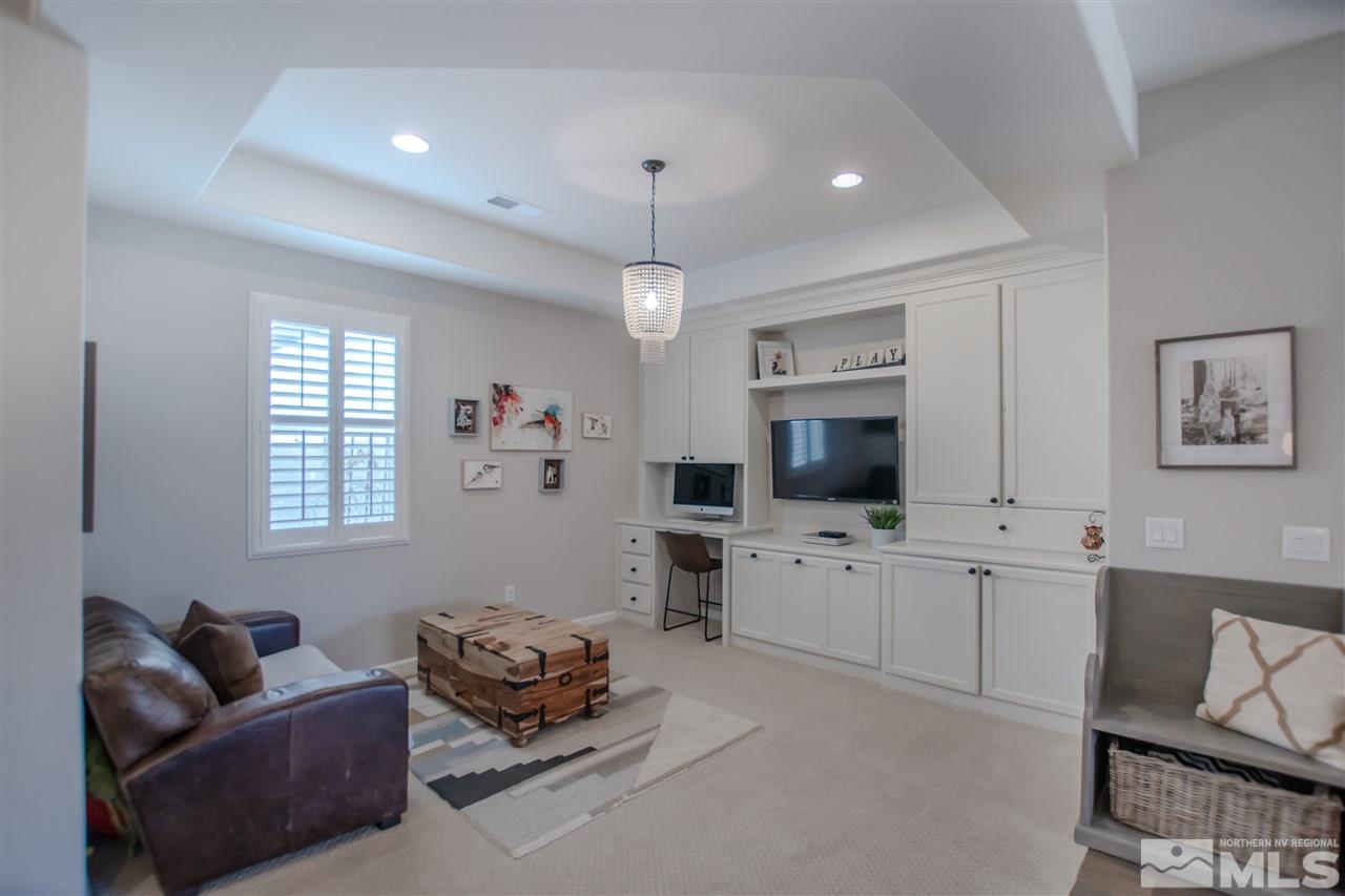 10020 Ellis Park Lane Reno, NV 89521 - Photo 2 of 24 a living room with furniture fireplace and a window