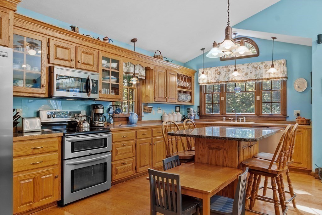 77 Turner Road Townsend, MA 01469 - Photo 13 of 34 a kitchen with stainless steel appliances granite countertop a stove and cabinets