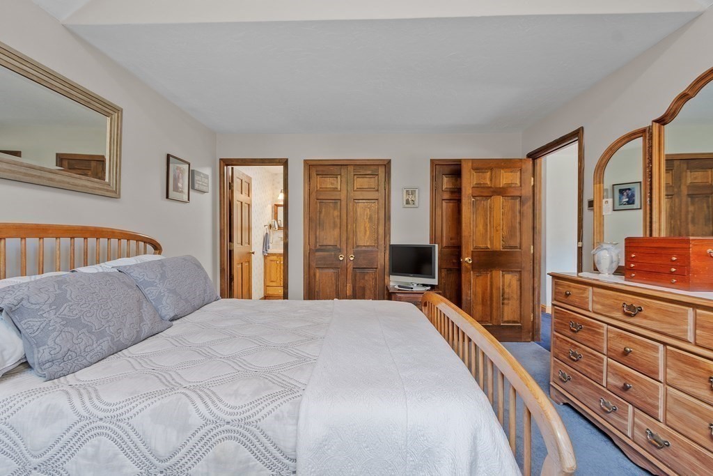 77 Turner Road Townsend, MA 01469 - Photo 26 of 34 a bedroom with a large bed and a dresser